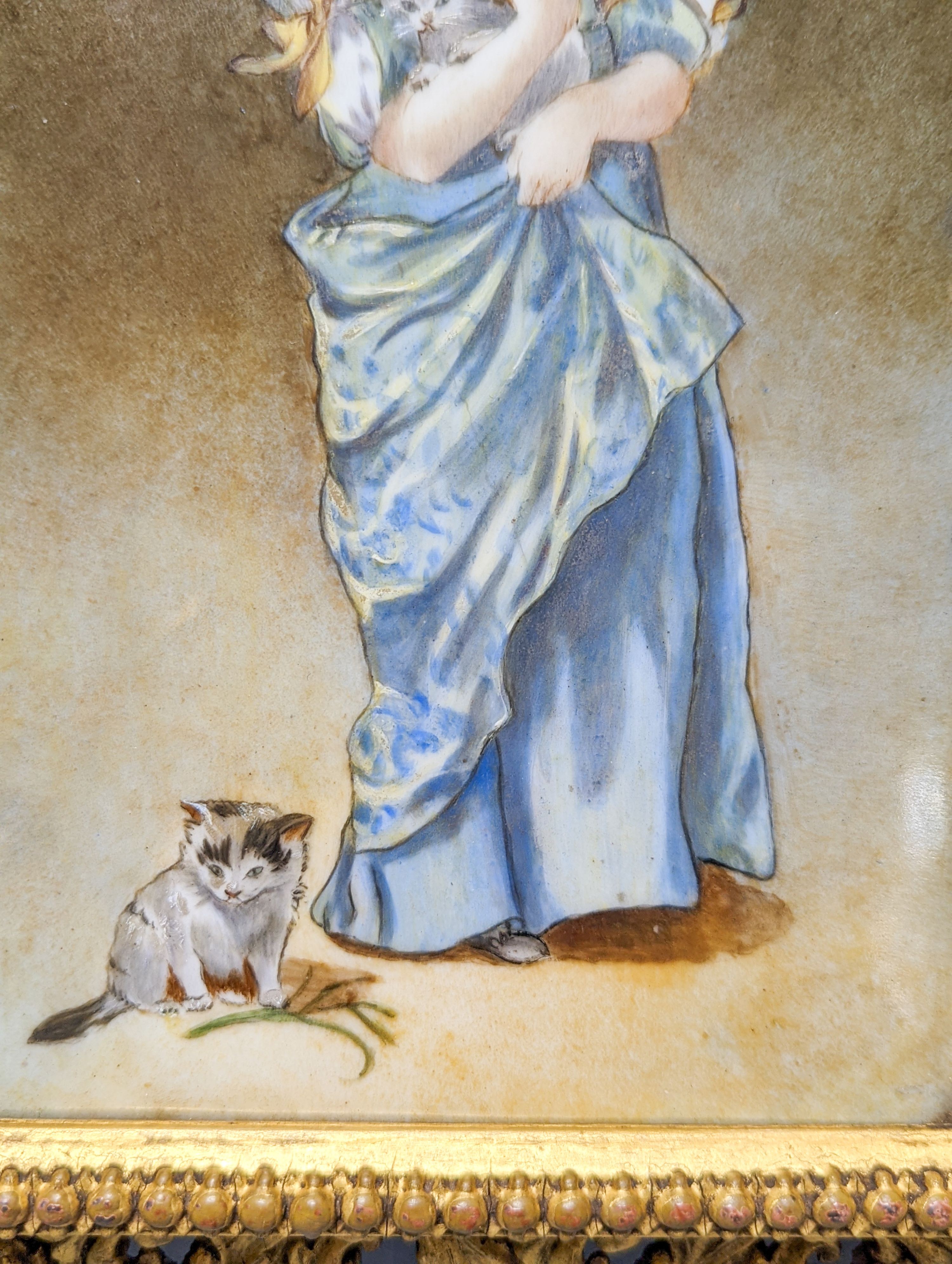 A Victorian porcelain plaque, painted with a girl with kittens, in gilt frame, 28.5 X 21 cm